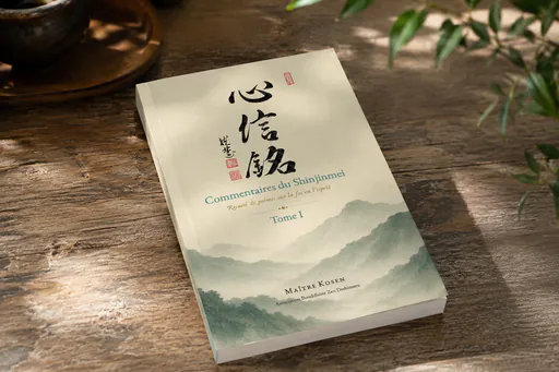Cover of the book Commentaries on the Shinjinmei, Volume I by Master Kōsen, resting on a wooden table